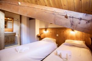 Postel nebo postele na pokoji v ubytování Chalet des Neiges Hermine + 37 fotografií