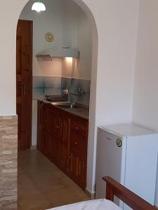 a kitchen with a sink and a counter top at Studio Lefteris in Skiathos