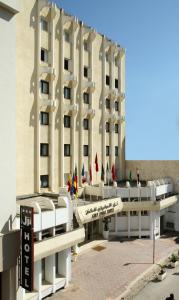 a large building with a lot of windows on top of it at Golf Royal Hotel in Tunis