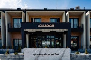 a hotel building with a sign in front of it at Hotel Bonvie in Sakarya