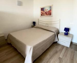 Postel nebo postele na pokoji v ubytování Viva Vista Mare Mono Piano Terra