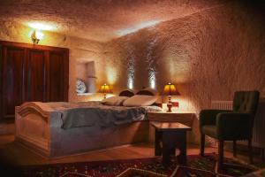 Postel nebo postele na pokoji v ubytování Asteria Cave Hotel