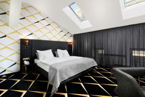 
Łóżko lub łóżka w pokoju w obiekcie IBB Grand Hotel Lublinianka
