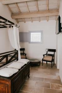 Ένα ή περισσότερα κρεβάτια σε δωμάτιο στο L'Ulivo Bianco +76 φωτογραφίες