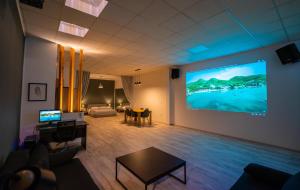 A television and/or entertainment centre at Cinema Zeus Studios - by Avelink