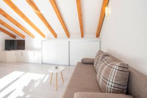 a living room with a couch and a table at Villa Stipe in Podstrana