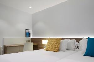 Postel nebo postele na pokoji v ubytování Hotel Parma