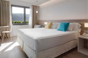 Postel nebo postele na pokoji v ubytování Hotel Parma