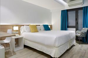 Postel nebo postele na pokoji v ubytování Hotel Parma