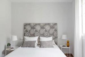 Postel nebo postele na pokoji v ubytování Apartamentos La Llum