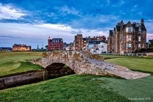 a stone bridge in front of a city at 2 Bedroom Apartment in a Quiet Neighbourhood in St. Andrews