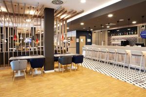 Restaurace v ubytování Holiday Inn Express Munich - Olympiapark by IHG