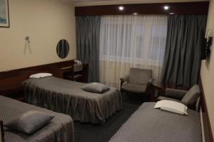 Postel nebo postele na pokoji v ubytování Hotel Druzhba