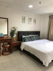 Llit o llits en una habitació de coralbay apartment pangkor island