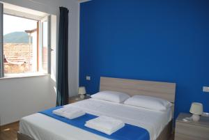 Ein Bett oder Betten in einem Zimmer der Unterkunft Il Borgo di Nonno Carlo