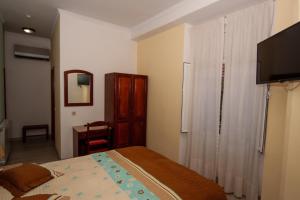 TV a/nebo společenská místnost v ubytování Hotel Leiriense