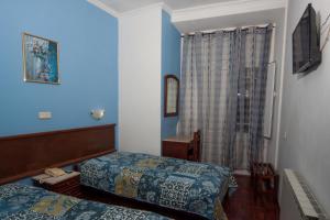 Postel nebo postele na pokoji v ubytování Hotel Leiriense