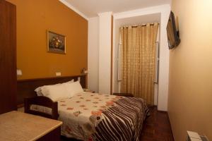 Postel nebo postele na pokoji v ubytování Hotel Leiriense