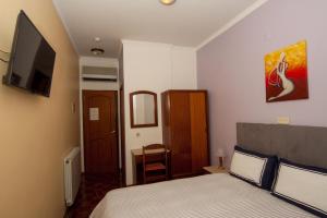 Postel nebo postele na pokoji v ubytování Hotel Leiriense