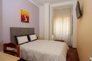 Postel nebo postele na pokoji v ubytování Hotel Leiriense