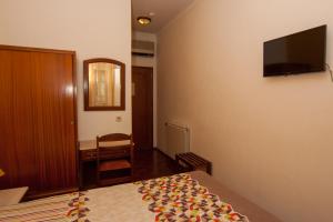 TV a/nebo společenská místnost v ubytování Hotel Leiriense