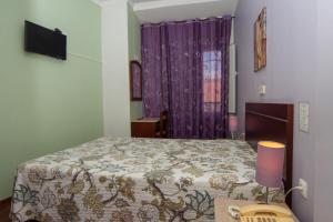 Postel nebo postele na pokoji v ubytování Hotel Leiriense