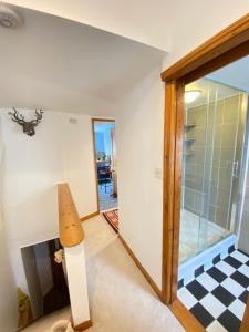 a room with a sliding glass door and a table at The Sail Loft in Kingsbridge +28 photos