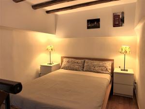מיטה או מיטות בחדר ב-Casa Trevi
