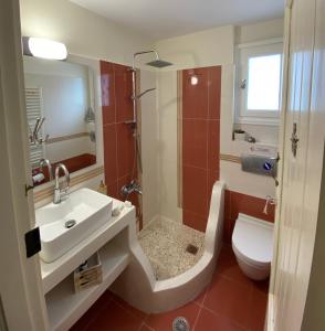 a bathroom with a sink and a toilet at Katerinas villa in Agia Anna Naxos