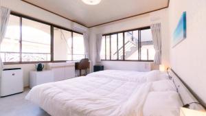 Voodi või voodid majutusasutuse VOYAN Resort Fujiyamanakako Gekkoso toas
