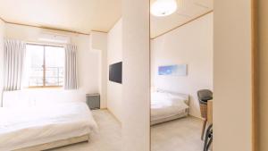 Voodi või voodid majutusasutuse VOYAN Resort Fujiyamanakako Gekkoso toas