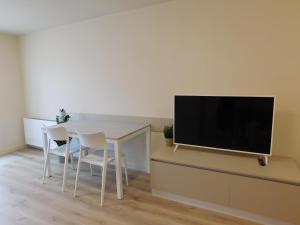 TV a/nebo společenská místnost v ubytování Residence La Mason