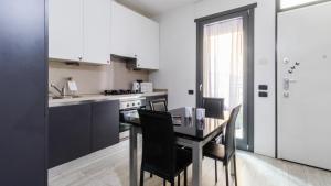 Virtuvė arba virtuvėlė apgyvendinimo įstaigoje Italianway - Marcantonio dal Re 20 C