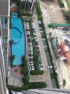 an aerial view of a parking lot with a pool at Supalai Rama9 Monthly in Bangkok