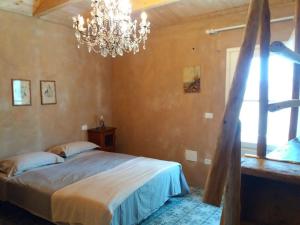 En eller flere senge i et værelse på Agriturismo di Charme e Ristorante Stallato Il Filo di Paglia