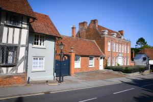 a row of brick houses on a street at The Gate Cottage in Thaxted