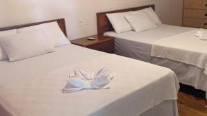 Tempat tidur dalam kamar di Coral View Beach Resort