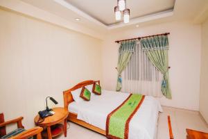 Letto o letti in una camera di Phú An Hotel