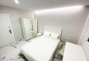Posteľ alebo postele v izbe v ubytovaní Apartamento San Félix, Playa La Caleta