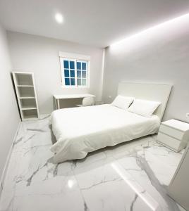 Posteľ alebo postele v izbe v ubytovaní Apartamento San Félix, Playa La Caleta