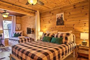a bedroom with a bed in a log cabin at Outdoor Lovers Haven in the Blue Ridge Mtns! in Blue Ridge