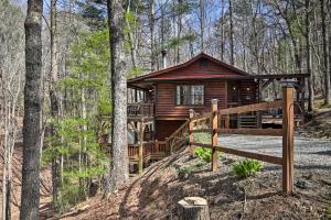 a log cabin in the woods with a wooden fence at Outdoor Lovers Haven in the Blue Ridge Mtns! in Blue Ridge