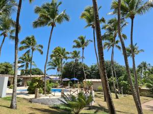 vista sulla piscina e sulle palme di Chalé 17 - Porto do Sol - Pipa a Pipa