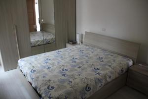 En eller flere senge i et værelse på A Due Passi dal Mare