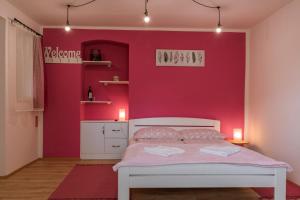 Postel nebo postele na pokoji v ubytování Julia Apartman