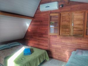 Postel nebo postele na pokoji v ubytování Residencial Chalés Riviera