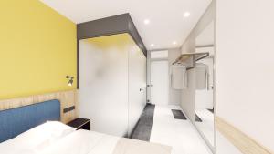 A bed or beds in a room at Dovzhenko