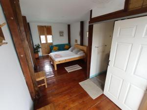 a view of a room with a bed and a door at Bidea Backpackers Hostel in Filandia