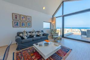 a living room with a couch and a table at VESTA - Soma Bay Residence in Hurghada