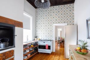 a kitchen with a refrigerator and a counter with food at Rus In De Rust in De Rust